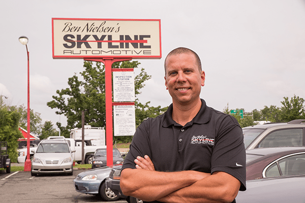 Ben Nielsen in front of Skyline Automotive.