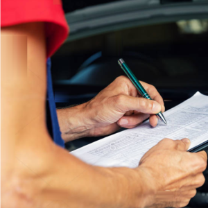 Techician Writing On Inspection Sheet.